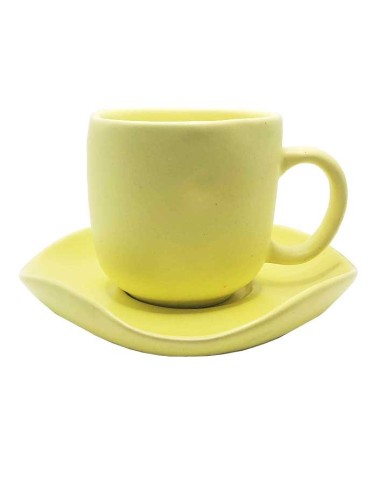 Yellow ceramic cup with matching saucer