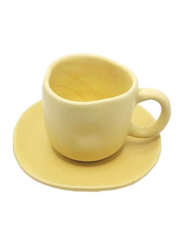 Beige ceramic cup with matching saucer